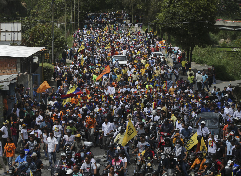 Opponents of President Nicolas Maduro march to the Ramo Verde military prison in Los Teques, on the outskirts of Caracas, Venezuela, on Friday. Venezuela's opposition called for a march to the prison where opposition leader Leopoldo Lopez is serving a nearly 14-year sentence for his role leading anti-government demonstrations in 2014.