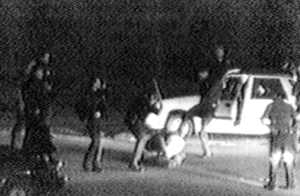This image converted from a 1991 video shows police officers beating Rodney King. King was pulled over by officers for speeding on a Los Angeles freeway.