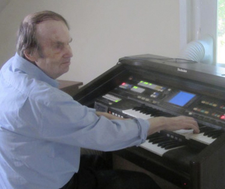 William Dean, who mastered the organ without any lessons, died in October 2016 at age 71, but the legal fight over his treatment by the state continues.