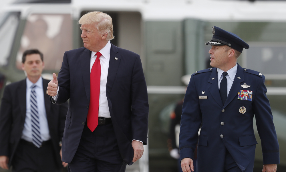President Trump gives the thumbs-up as he walks to board Air Force One on Saturday en route to Harrisburg, Pa. Trump has signed executive orders but not any major legislation.