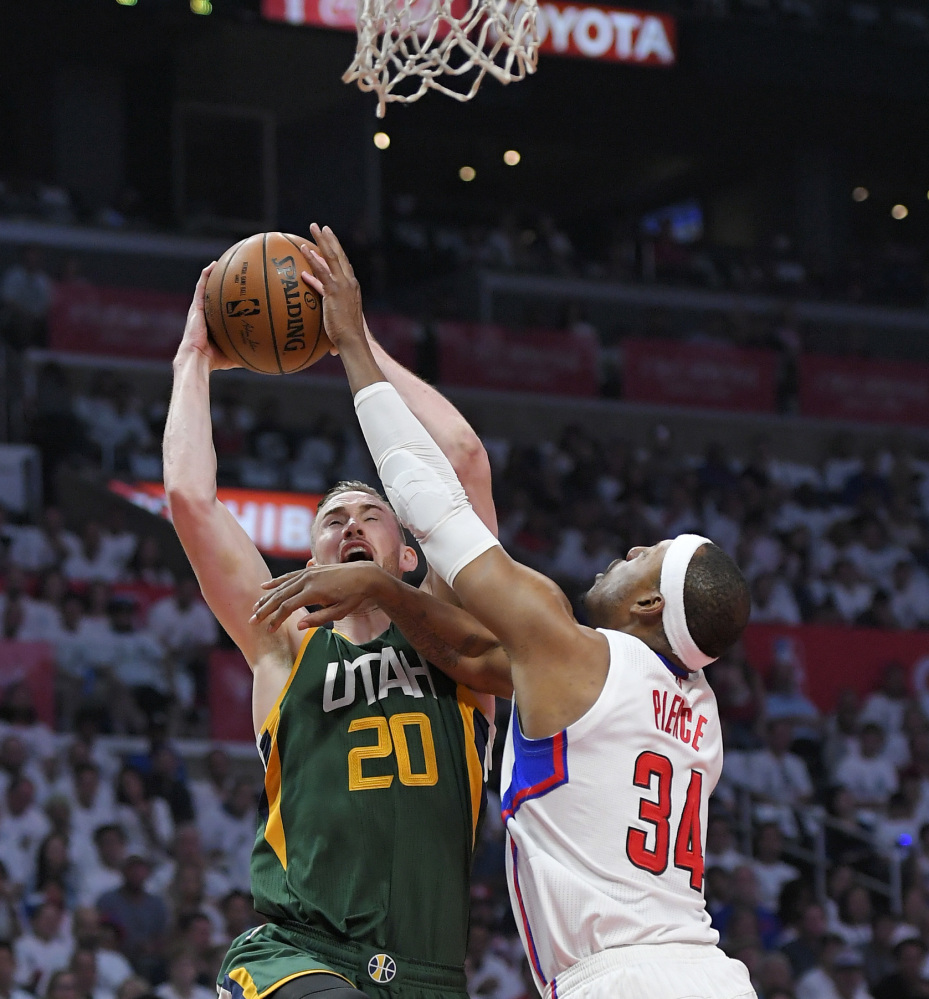 Utah forward Gordon Hayward shoots while being defended by Clippers forward Paul Pierce on Sunday in Los Angeles. The Jazz won to win the series.