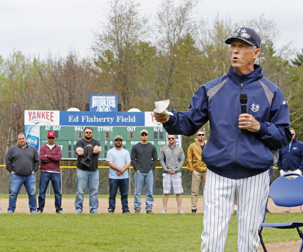 As members of his 1991 and 1997 national championship teams look on, USM Coach Ed Flaherty speaks Sunday during a ceremony in which the school's baseball field was named Ed Flaherty Field.