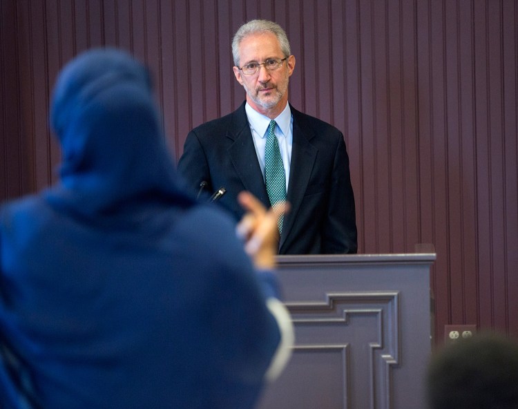 Stephen Schwartz, the U.S. ambassador to Somalia, listens to a woman's question while speaking with the public in Lewiston on Thursday. Schwartz fielded questions about the Somalian government, American foreign policy in Africa, and President Trump’s executive order that would impose a 90-day ban on travelers from six Muslim-majority countries, including Somalia. 
