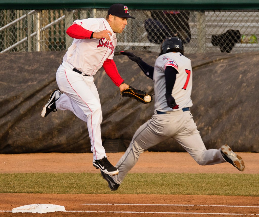 Sea Dogs first baseman Mike Olt handles a bad throw to put out Binghamton's Tomas Nido at first in Monday night's win.