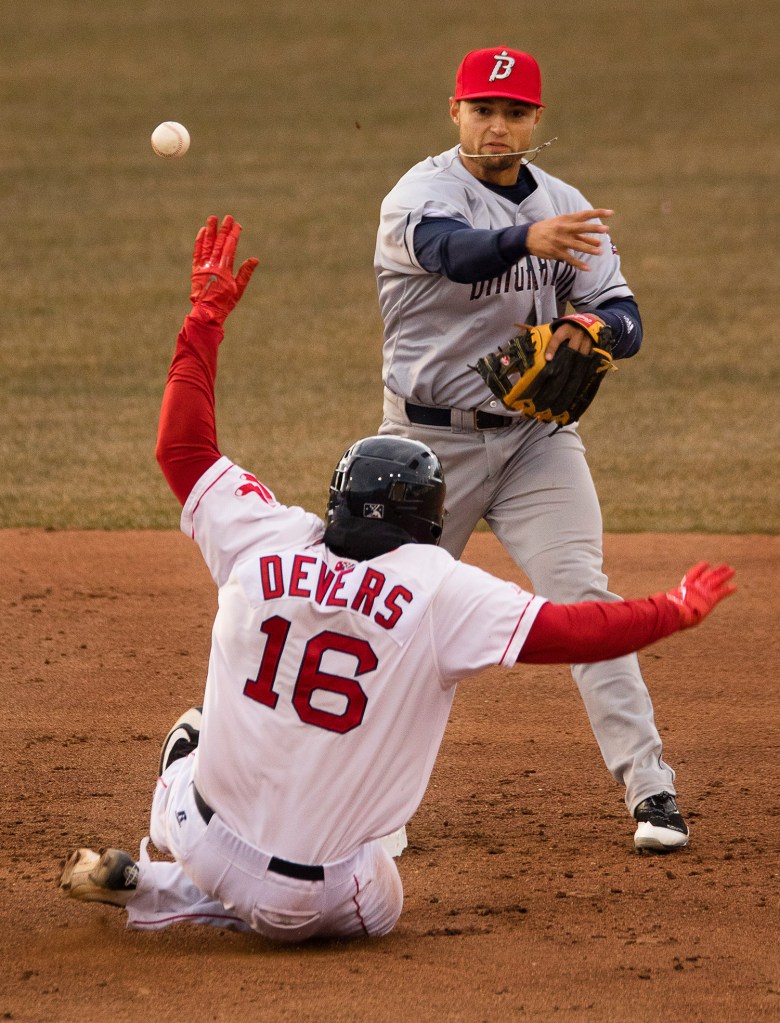 Portland's Rafael Devers slides into second while Binghamton infielder Li Mazzilli tries, but fails, to turn a double play in the second inning.