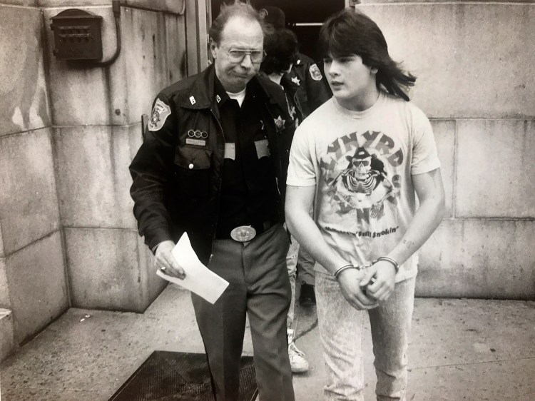 Anthony Sanborn is led from the Cumberland County Courthouse on April 19, 1990, while waiting to be arraigned in the murder of Jessica Briggs.