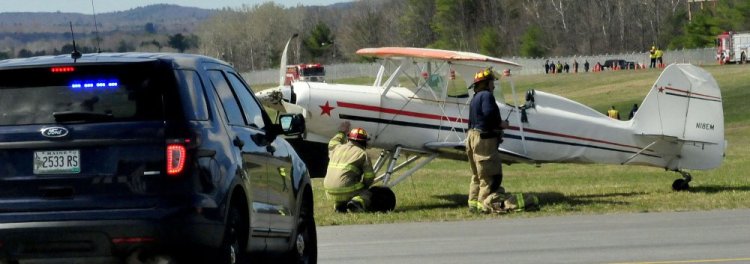 Waterville police and firefighters on the scene at the Waterville Airport on Sunday.