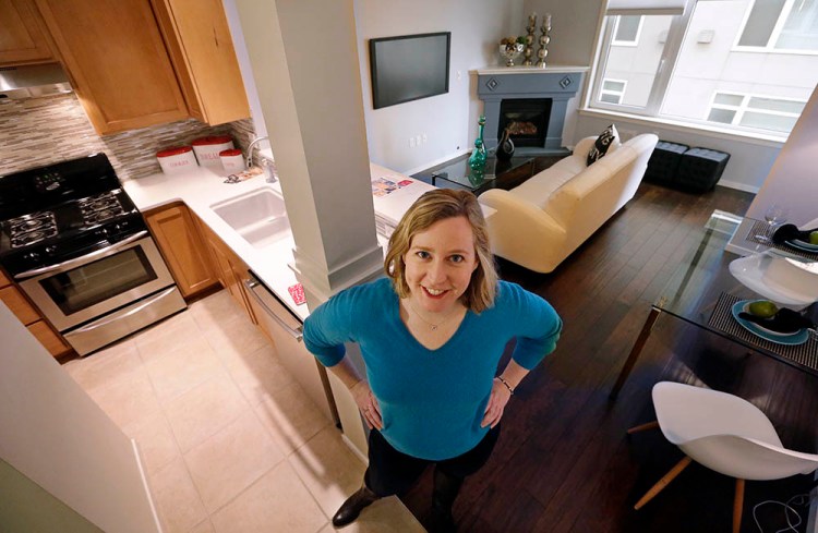 Kathleen Mulcahy stands in her recently sold, one-bedroom condo, for which she received nearly two dozen offers and sold for more than $100,000 over her asking price, in Seattle's Belltown neighborhood. Many would-be buyers, especially in the big cities, will be wading into a market that's crowded with rival buyers and constrained by the lowest inventory of homes for sale in nearly two decades. 