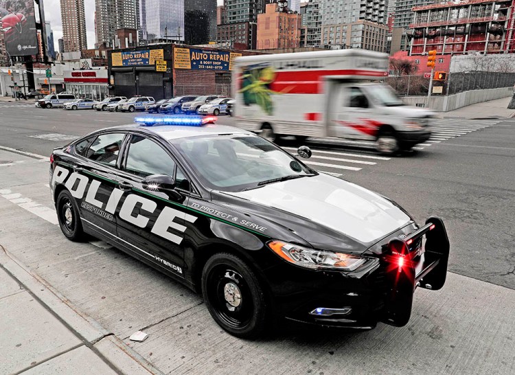 A prototype of the Ford Fusion Responder hybrid sits along 11th Avenue in New York. 