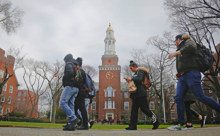Students walk between classes at Brooklyn College, where current tuition for in-state undergraduates is $6,838 a year.