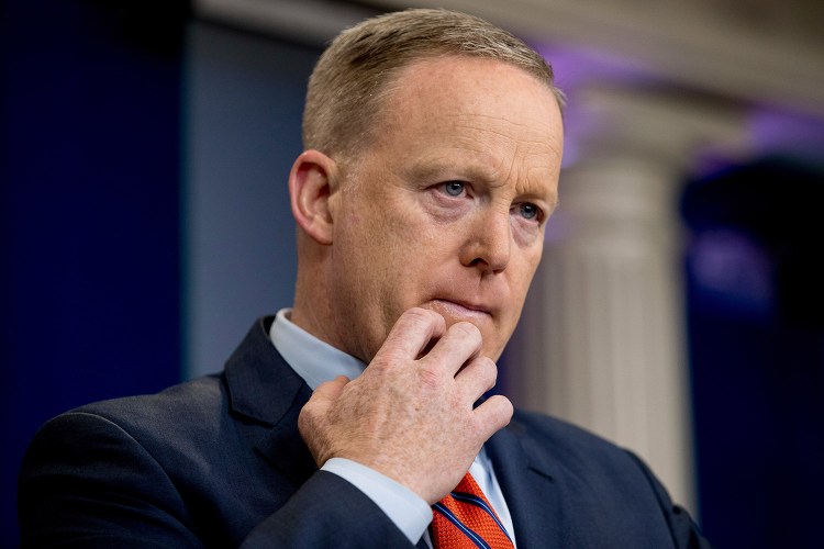 White House press secretary Sean Spicer pauses while talking to the media Tuesday during the daily press briefing at the White House in Washington. 