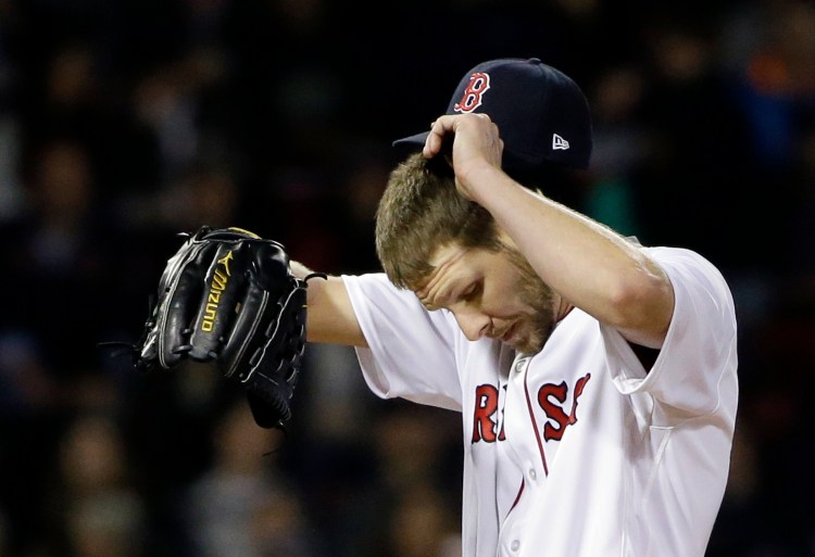 Red Sox starter Chris Sale reacts after giving up a run in the ninth inning Thursday night against the Yankees at Fenway Park.