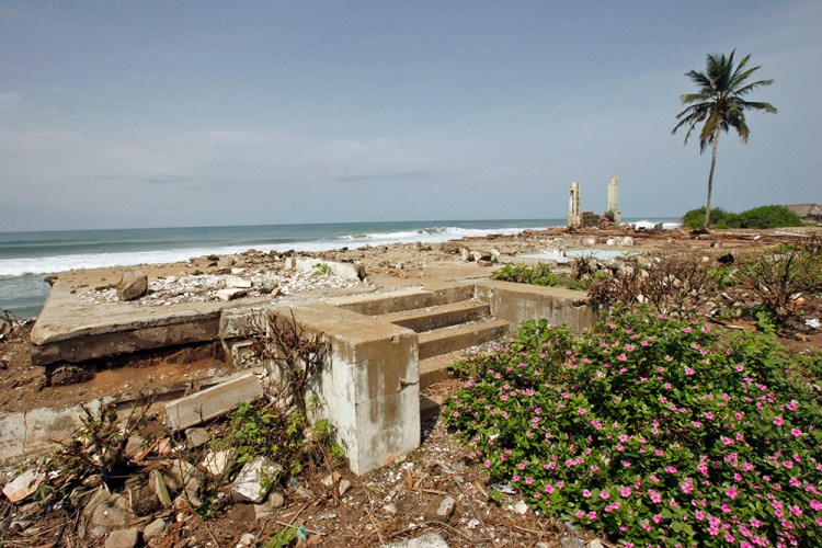The ruins of houses destroyed by erosion line a beach in Grand-Lahou on the southern Ivory Coast. In populated coastal West Africa, rising sea levels linked to the melting of the polar ice caps are conspiring with coastal erosion to slowly submerge communities.  