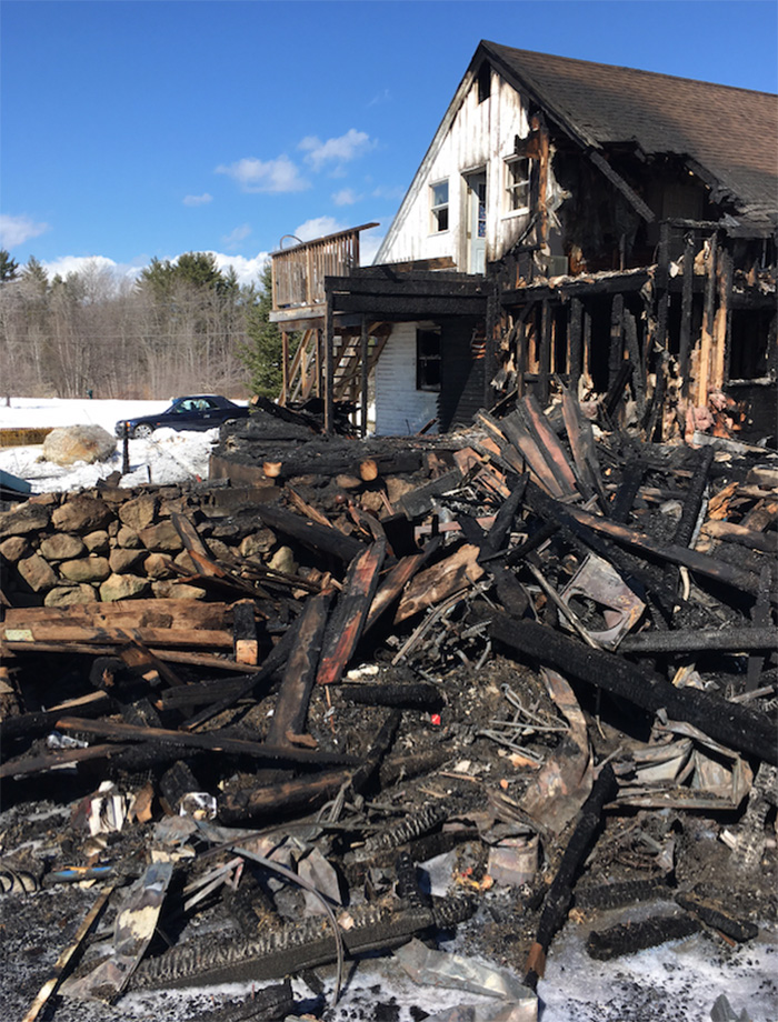 A two-story barn was destroyed and an attached farmhouse made uninhabitable by a fire Sunday on Foxes Ridge Road in Acton.