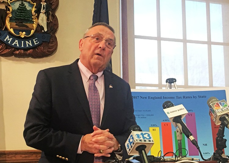 Gov. Paul LePage talks to the news media at the State House on Monday. "I went to the public with welfare reform, after the Legislature ignored me for four years," he said. "When I figured out that if you talk to the people, they will put pressure on and get it done."
