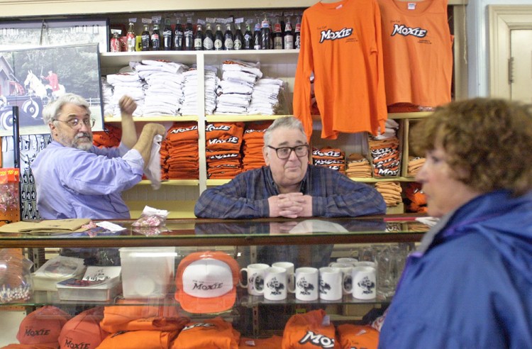 Frank Anacetti waits on a customer in 2003 at his Lisbon Falls store, which had been selling Moxie since it opened in 1914. 