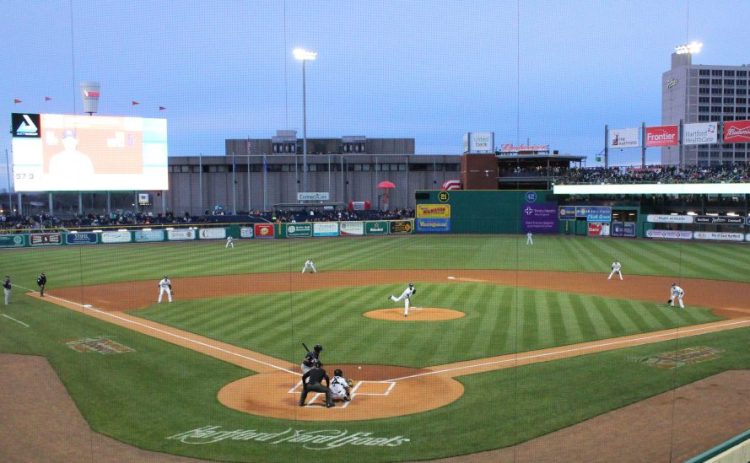 Pitcher Yency Almonte throws the first pitch at Hartford's new Dunkin' Donuts Park on April 13. Issues with the stadium forced the Yard Goats to play on the road all last season.