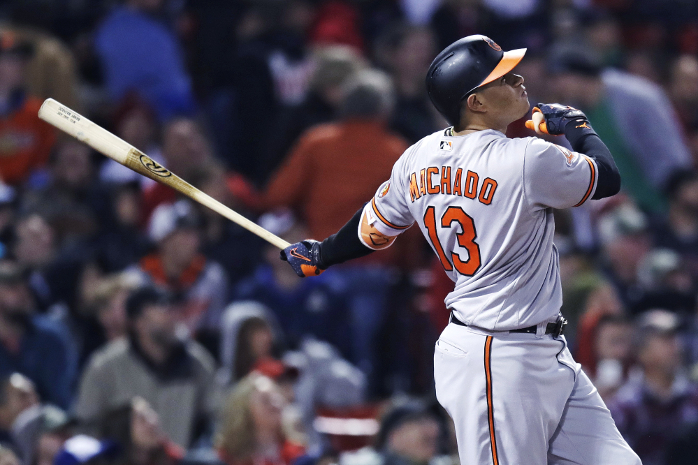 The Orioles' Manny Machado watches the flight of his solo home run in the sixth inning.