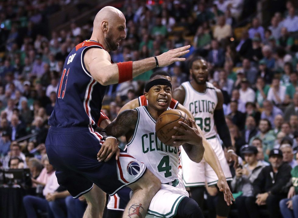 Boston Celtics guard Isaiah Thomas drives to the basket against Washington Wizards center Marcin Gortat, left, during the first quarter Tuesday in Boston.