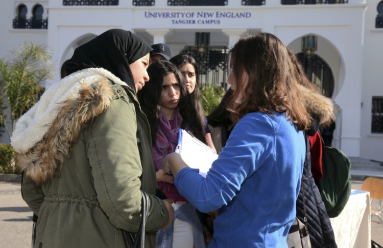 Political science major and resident assistant Clancy Phillips, right, speaks to prospective students at an open house at the University of New England's satellite campus in the Moroccan coastal city of Tangier. In response to concerns about anti-immigrant sentiment, some U.S. colleges are making new efforts to help international students feel welcome and reassure them of their safety.