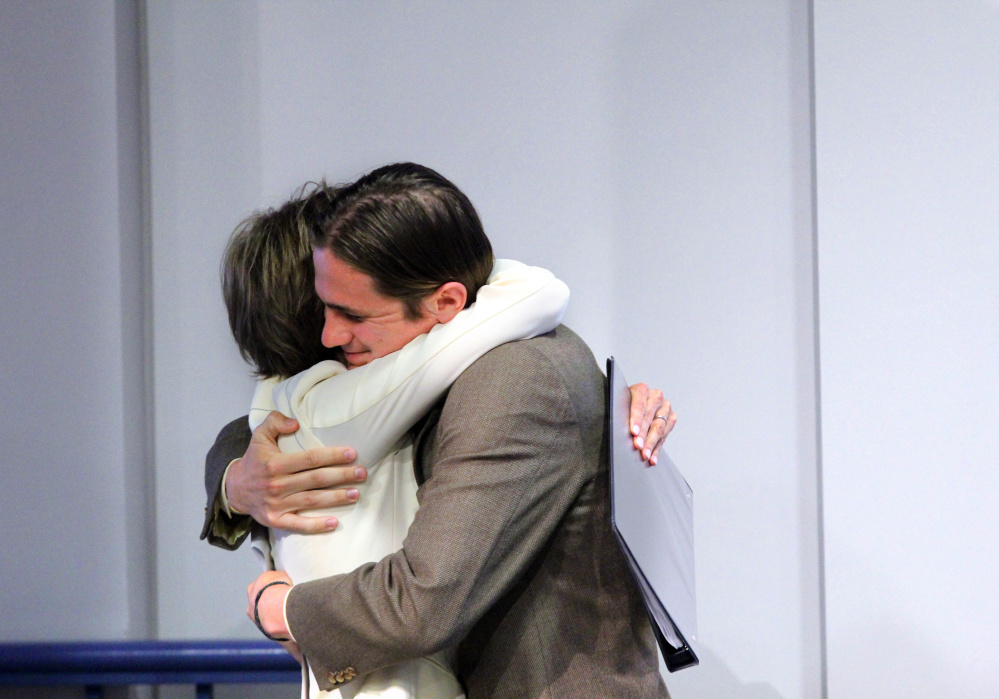 Colby College senior Quill Yates gives his mother — former Acting U.S. Attorney General Sally Yates — a hug after introducing her Wednesday night during her visit to the college campus in Waterville.