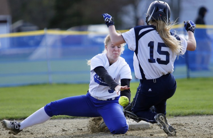 Britney Gregoire of Kennebunk attempts to handle the throw as Ally Gagne of Poland steals second base Wednesday during the fourth inning of Kennebunk's 6-2 victory at home.