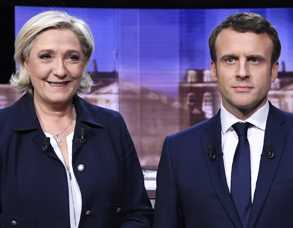 French presidential election candidates Marine Le Pen and Emmanuel Macron meet for a debate Wednesday.