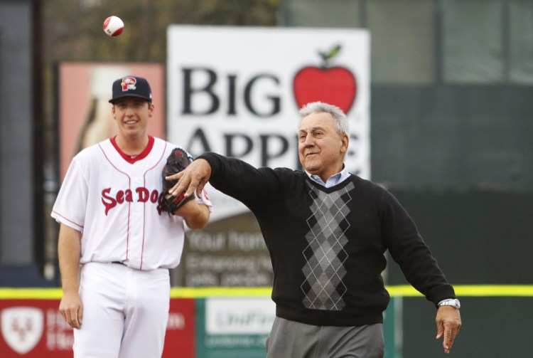 With pitcher Teddy Stankiewicz looking on, Rico Petrocelli, the former Red Sox infielder, delivers the first pitch Thursday night at Hadlock Field prior to the Portland Sea Dogs' game against the Reading Fightin Phils.