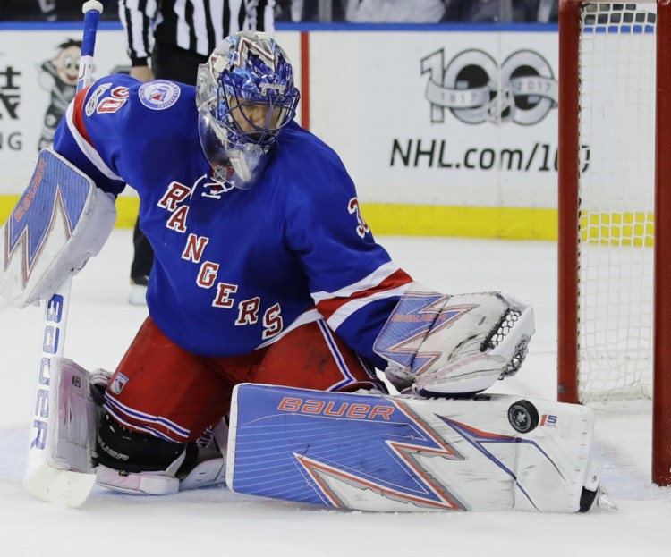 Rangers goalie Henrik Lundqvist makes one of his 22 saves Thursday against Ottawa in Game 4 of their Eastern Conference semifinal series. The Rangers won 4-1, evening the series at 2-2.