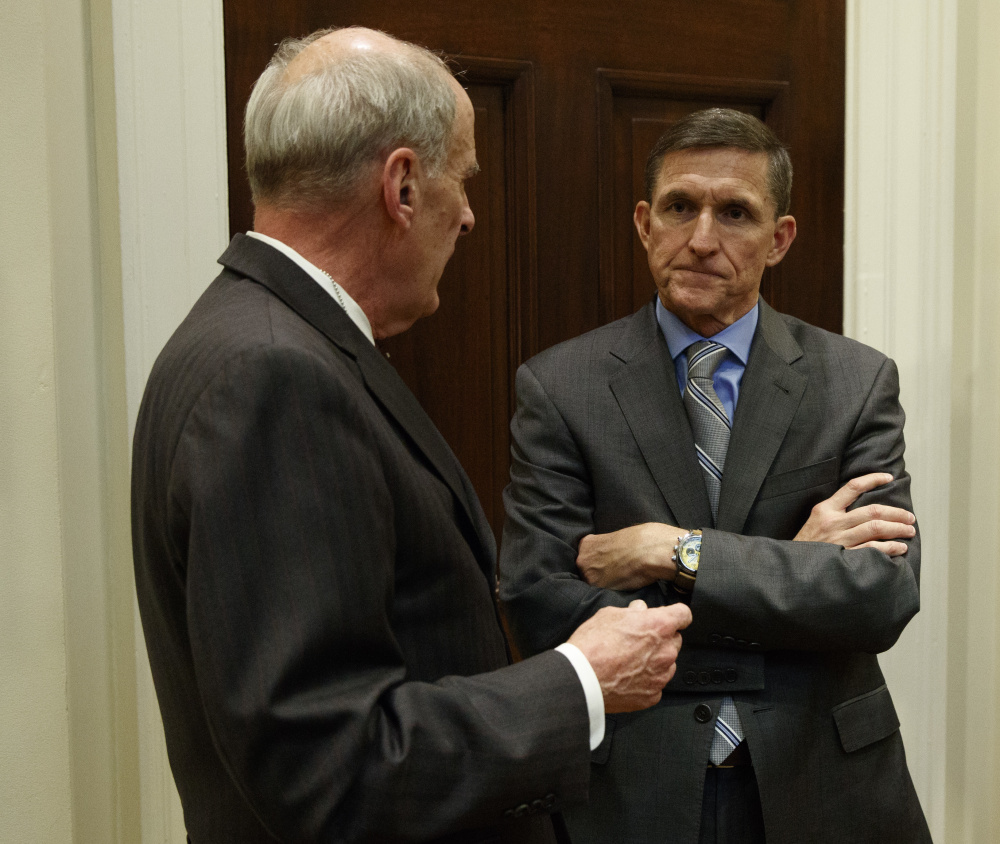 Former National Security Adviser Mike Flynn, right, talks with Ret. Gen. Keith Alexander before a meeting with President Trump on cyber security in January.