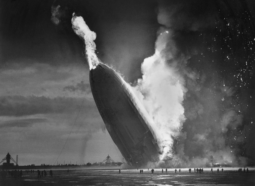 In this May 6, 1937 file photo, the German dirigible Hindenburg crashes to earth in flames after exploding at the U.S. Naval Station in Lakehurst, N.J. Only one person is left of the 62 passengers and crew who survived when the Hindenburg burst into flames 80 years ago Saturday. Werner Doehner was 8 years old when he boarded the zeppelin with his parents and older siblings after their vacation to Germany in 1937. The 88-year-old, now living in Parachute, Colo., told The Associated Press that the airship pitched as it tried to land in New Jersey and that "suddenly the air was on fire."