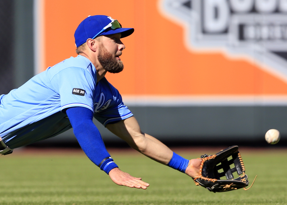 Royals left fielder Alex Gordon catches a fly ball hit by the Indians' Abraham Almonte during the seventh inning of their game Saturday in Kansas City, Mo. Cleveland won 3-1.