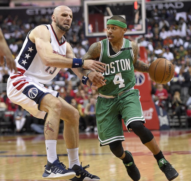 Boston Celtics guard Isaiah Thomas dribbles against Wizards center Marcin Gortat during the second half in Game 4 on  Sunday in Washington.