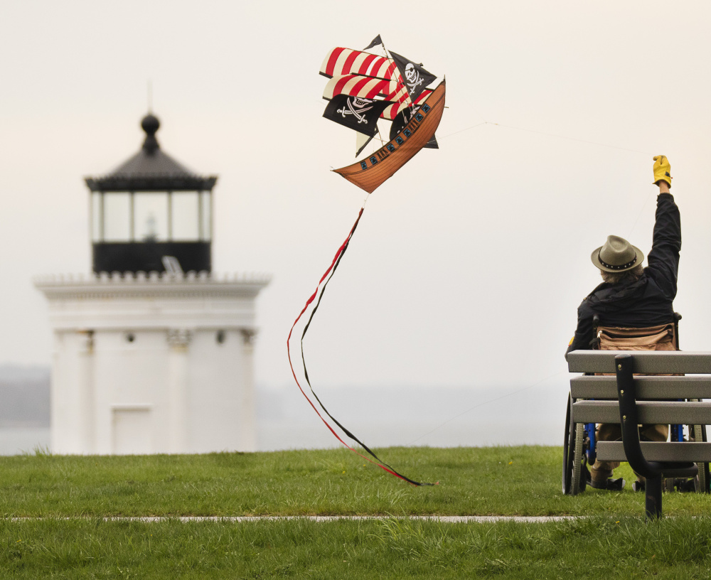 Dave Hunt of Dresden flies a kite at Bug Light Park in South Portland on Sunday. Starting May 20, licensed food trucks can be at the park to serve visitors from 8 a.m. to 8 p.m. near the Bug Light.