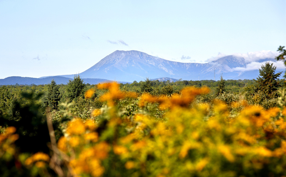 Mount Katahdin is seen from Route 159 in Patten, bordering the Katahdin Woods and Waters National Monument. President Trump's move to review the designation has cast a pall over its immediate success.