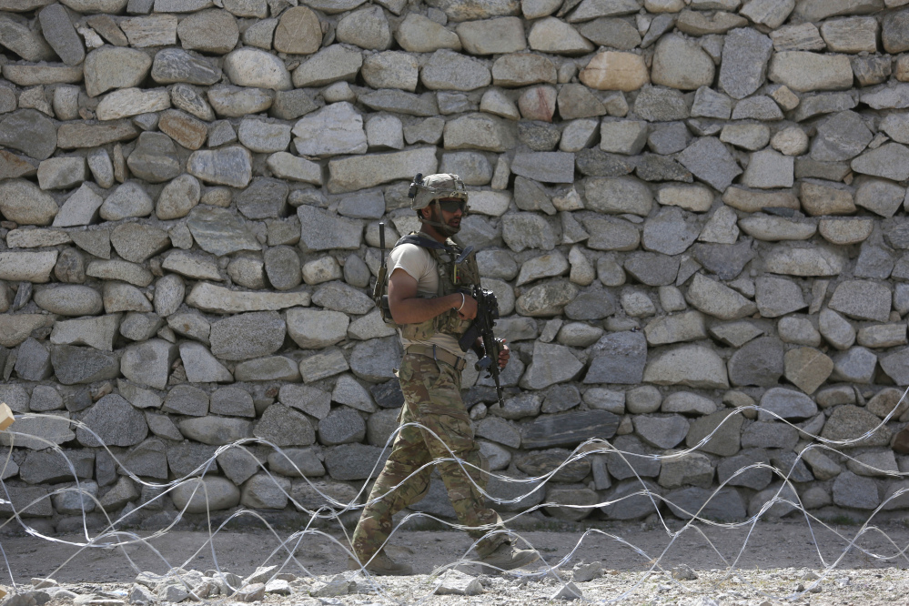 A U.S. soldier patrols near the site of a bombing in Jalalabad, east of Kabul, Afghanistan, in April. The Trump administration is considering sending more troops to Afghanistan as prospects are narrowing for a negotiated peace settlement with the Taliban.