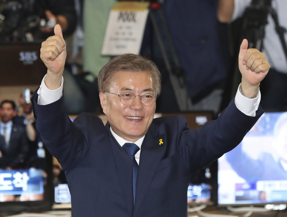 South Korea's  new president Moon Jae-in of the Democratic Party celebrates on Tuesday.
Associated Press/
Lee Jin-man