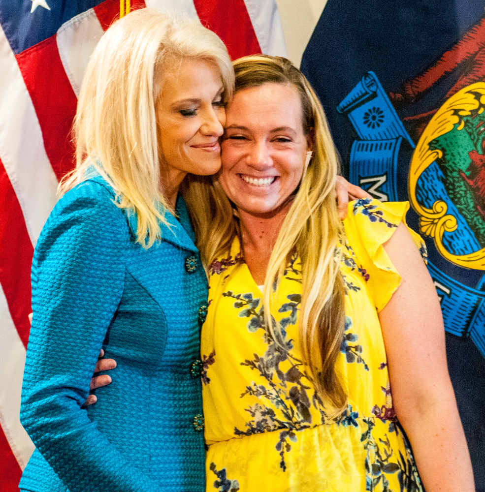 Kellyanne Conway, counselor to the president, left, hugs Liza Parker after Parker shared her story of overcoming an addiction to heroin and opioids at a news conference on Wednesday at the State House in Augusta.