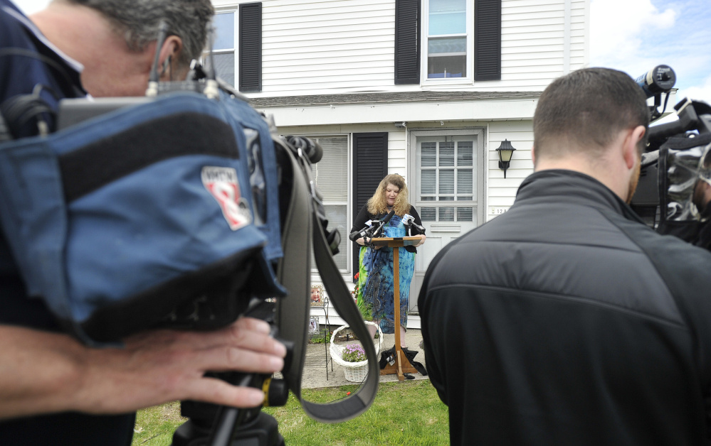 Outside the Portland home of state Rep. Diane Russell, Sandra Scribner Merlim of Naples talks Wednesday about her husband, Otto Morales-Caballeros, who is awaiting deportation.