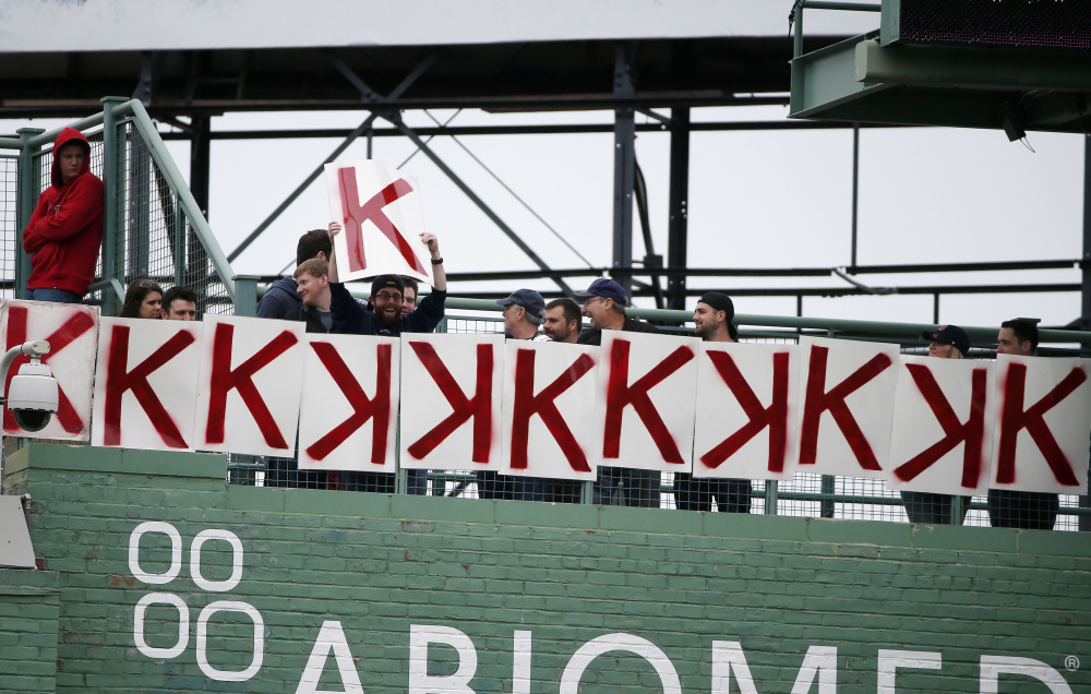 Fans display a K for each of Boston Red Sox's Chris Sale's strikeouts during the seventh inning of a baseball game against the Tampa Bay Rays, Saturday, May 13, 2017, in Boston.