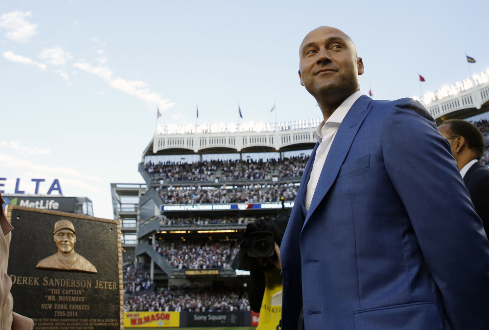 Former New York Yankees shortstop Derek Jeter is honored during a pregame ceremony Sunday at Yankee Stadium in New York. Jeter's No. 2 was retired and a plaque in his honor will be placed in Monument Park at the stadium.