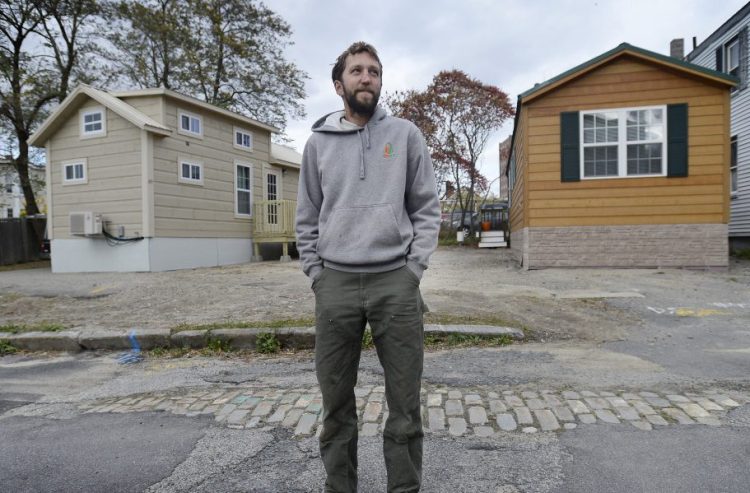 Brent Adler in October with the two tiny houses he placed in the Bayside area without having the required permits. Adler will pay a $1,000 fine and has until July 3 to remove the homes. Staff file photo by Shawn Patrick Ouellette