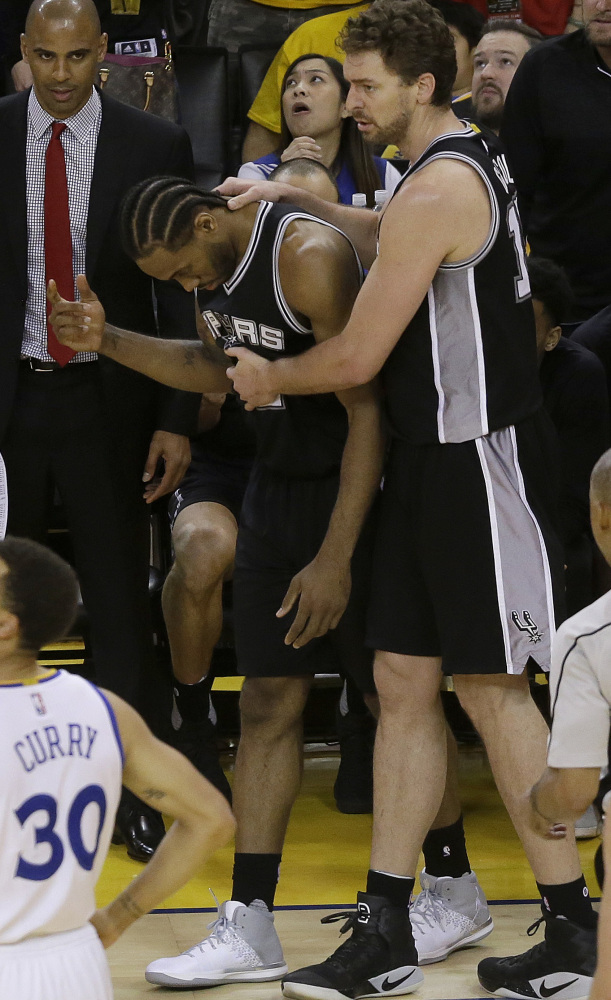 San Antonio forward Kawhi Leonard, center, has been ruled out for Game 2 of the Western Conference finals with an ankle injury.