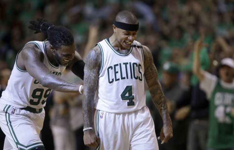 Celtics guard Isaiah Thomas celebrates his basket with Jae Crowder in the fourth quarter of Game 7 Monday night in Boston.