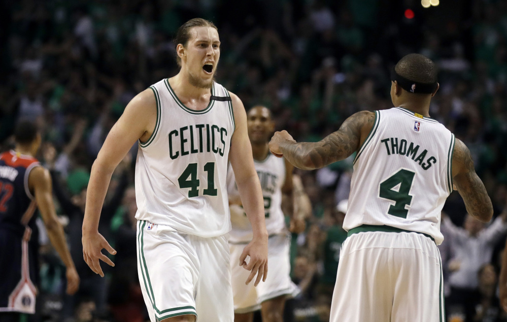 Celtics center Kelly Olynyk celebrates his basket with Isaiah Thomas in the fourth quarter, when Olynyk went on a tear to help the Celtics win. Olynyk finished with 26 points.