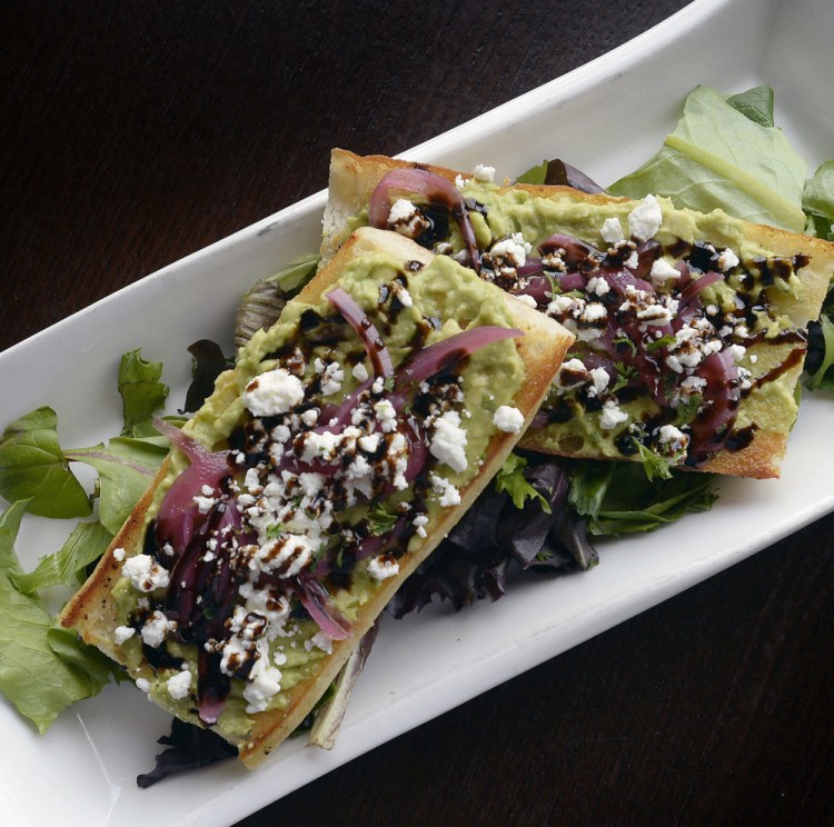 At Ri Ra in Portland, the avocado toast that is popular with millennials comes on a "grilled ... baguette with crunchy pickled red onion & tangy goat cheese" for $9.