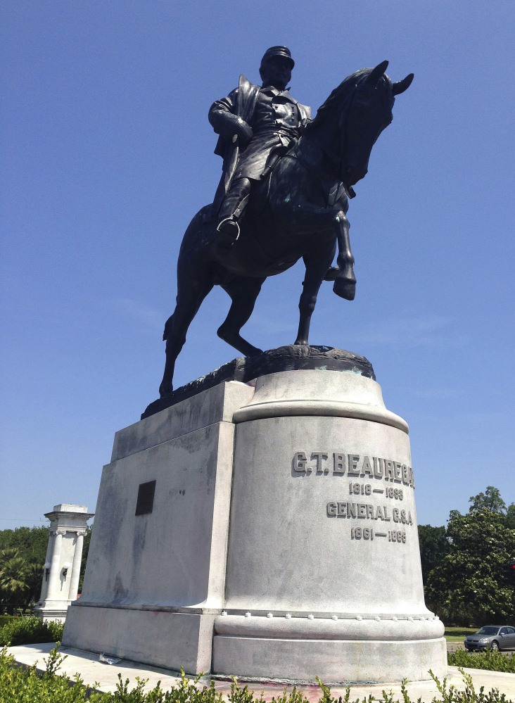 Confederate Gen. P.G.T. Beauregard's statue in New Orleans came down Wednesday under the cover of darkness, the third of four statues the city is removing.