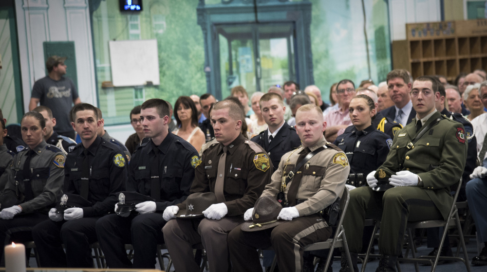 Officer Tyler LaFreniere, of Madison, front row right, sits with his graduating class at the Maine Criminal Justice Academy graduation ceremonies on Friday in Vassalboro. LaFreniere is joining the Somerset County Sheriff's Office.