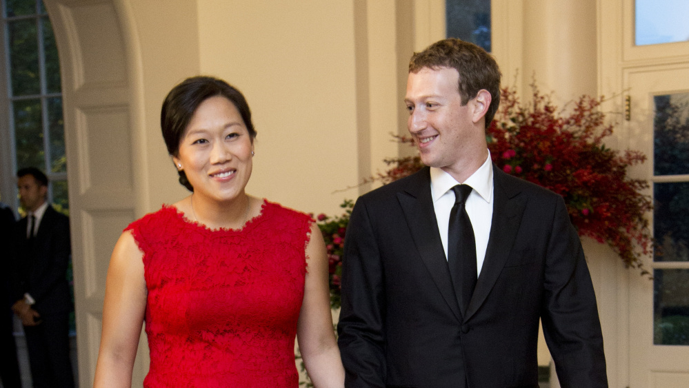 Facebook Chairman and Chief Executive Officer Mark Zuckerberg and his wife, Priscilla Chan, arrive for a state dinner in the East Room of the White House in 2015.