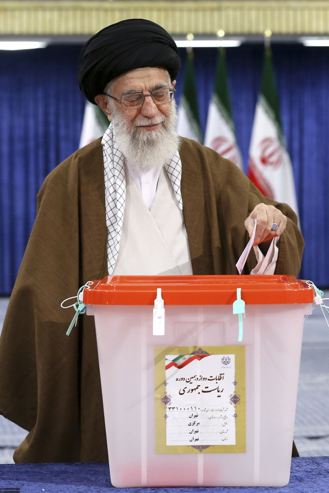 Ayatollah Ali Khamenei casts his ballot in the presidential election in Tehran, Iran, on Friday. Iranians voted in the country's first presidential election since its nuclear deal with world powers, as incumbent Hassan Rouhani faced a staunch challenge from a hard-line opponent over his outreach to the West.
